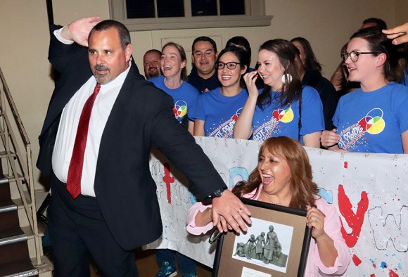 Lemoore Liberty Middle School principal, Ben Luis, celebrates with staff and students after his selection as the Kings County Administrator of the Year Tuesday night at the Kings County Excellence in Education Awards Ceremony.
